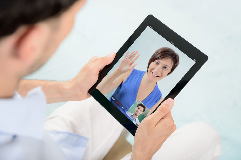 Couple chatting on Skype - long distance relationship