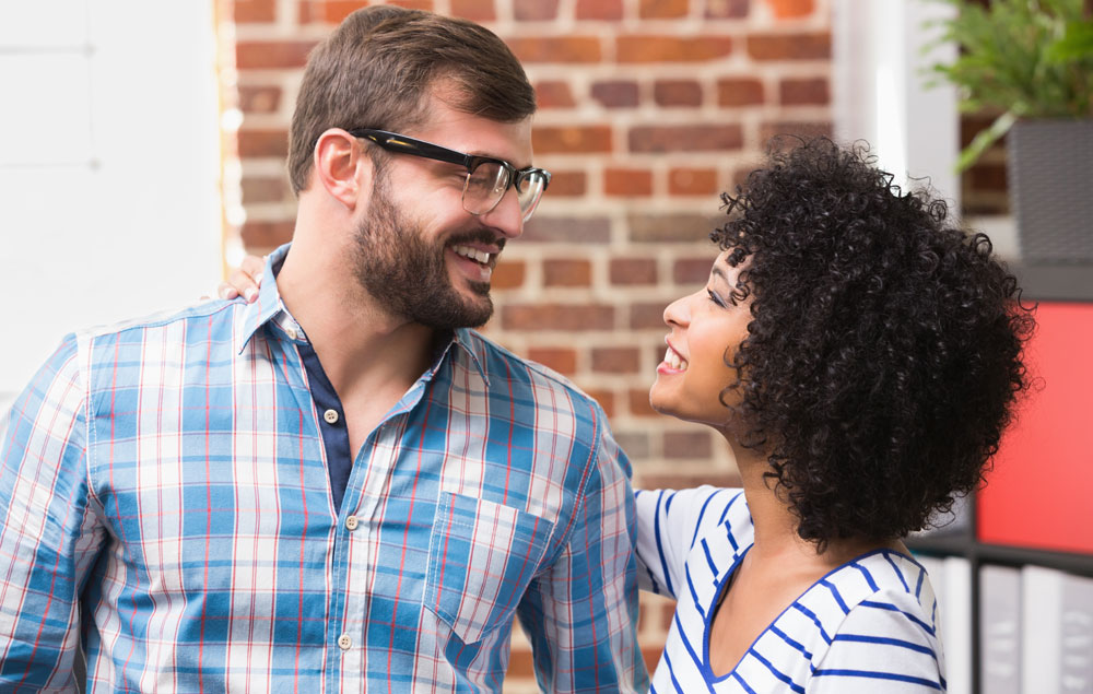 A man giving a woman a compliment after making her feel attracted