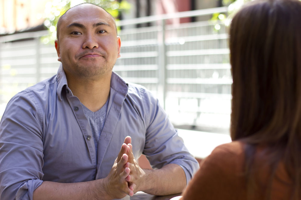 Nervous guy interacting with beautiful woman