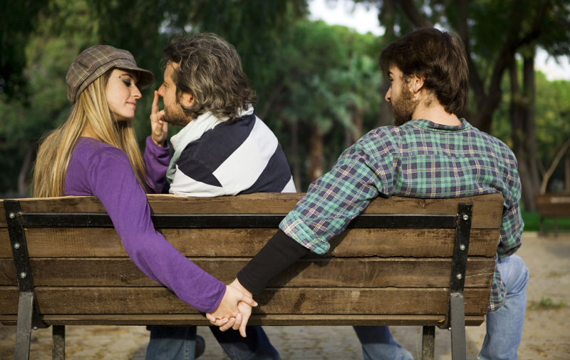 Untrustworthy woman flirting with other guy